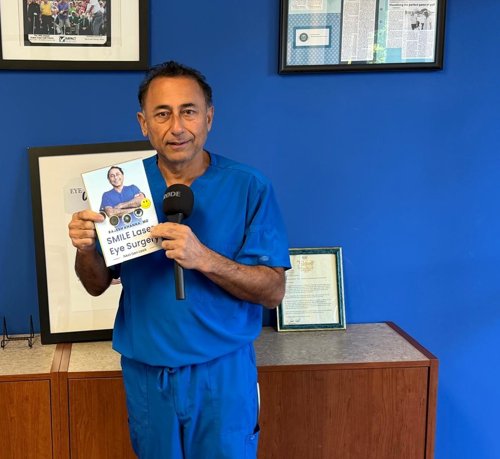 Dr. Rajesh Khanna, MD holding an eye surgery book for CXL keratoconus page